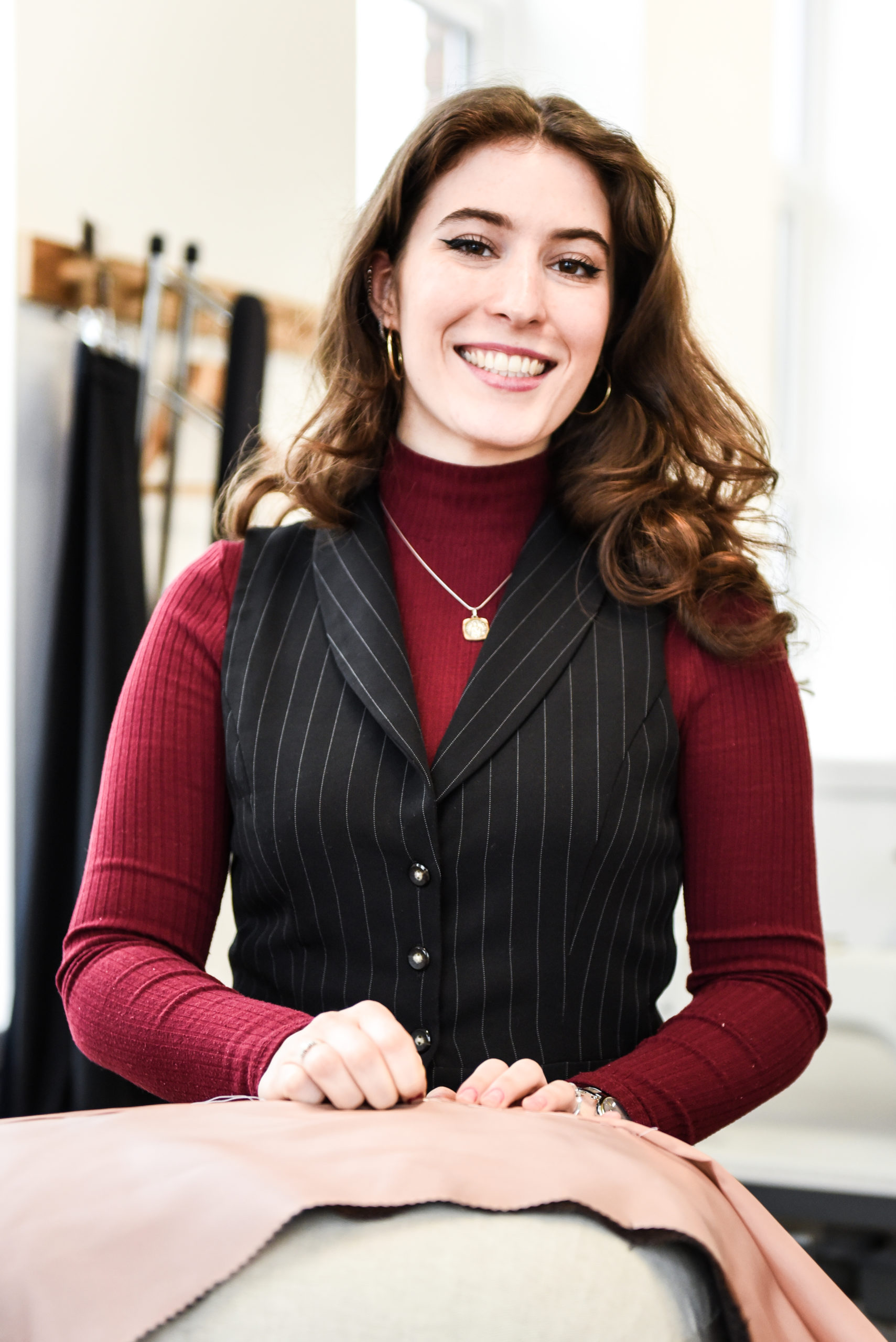 Student participating in a course learning bespoke tailoring
