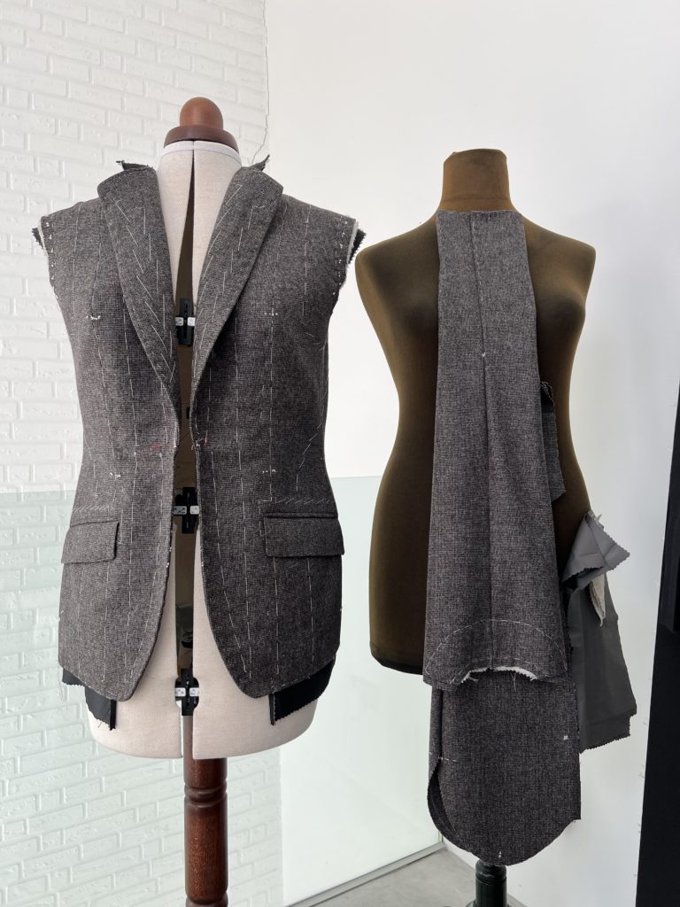 A bespoke jacket in the making, shown on a tailor's mannequin.